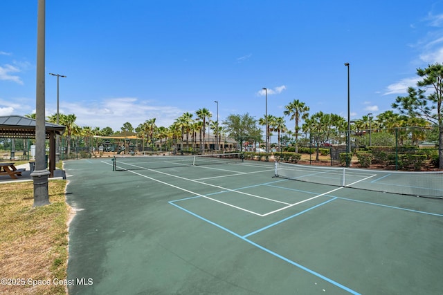 view of sport court featuring a gazebo, fence, and community basketball court