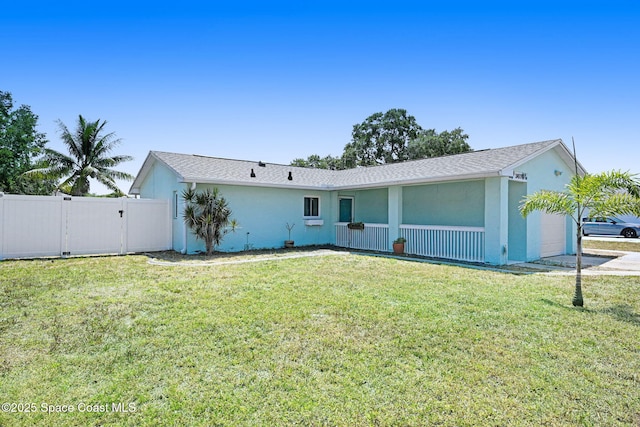 single story home with stucco siding, fence, a front lawn, and a garage