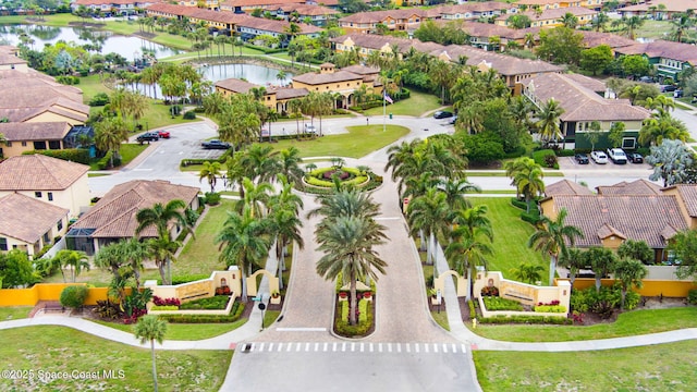 bird's eye view featuring a residential view and a water view