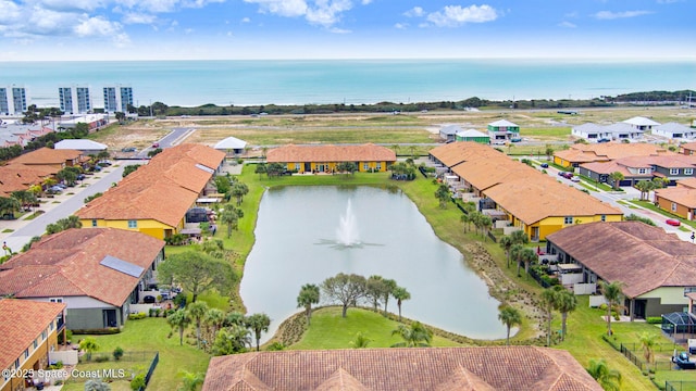 birds eye view of property with a residential view and a water view