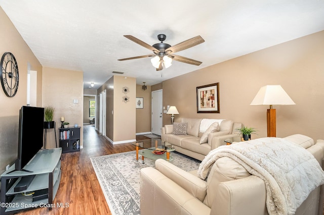 612 Saint Albans Ct Unit 19B, West Melbourne, FL 32904 - living area featuring a ceiling fan, baseboards, visible vents, and wood finished floors