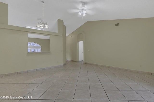 unfurnished living room with visible vents, arched walkways, light tile patterned floors, high vaulted ceiling, and ceiling fan with notable chandelier