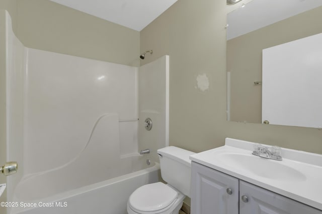bathroom featuring vanity, toilet, and tub / shower combination