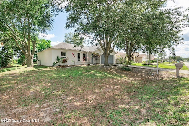 1500 Gardenton St NW Unit 44, Palm Bay, FL 32907 - ranch-style house with a garage, stucco siding, a front yard, and driveway
