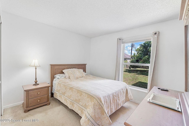 1500 Gardenton St NW Unit 44, Palm Bay, FL 32907 - bedroom with light colored carpet, a textured ceiling, and baseboards