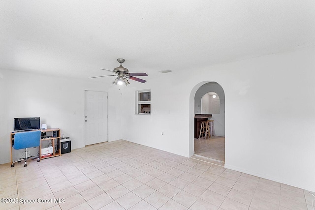 1500 Gardenton St NW Unit 44, Palm Bay, FL 32907 - unfurnished room with arched walkways, a ceiling fan, and light tile patterned floors
