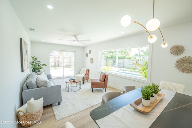 living room with recessed lighting, ceiling fan, visible vents, and wood finished floors