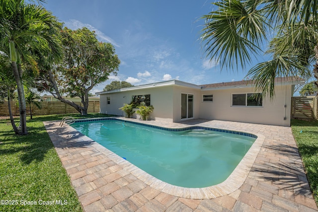 outdoor pool featuring a patio and a fenced backyard