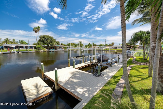 view of dock featuring boat lift and a water view