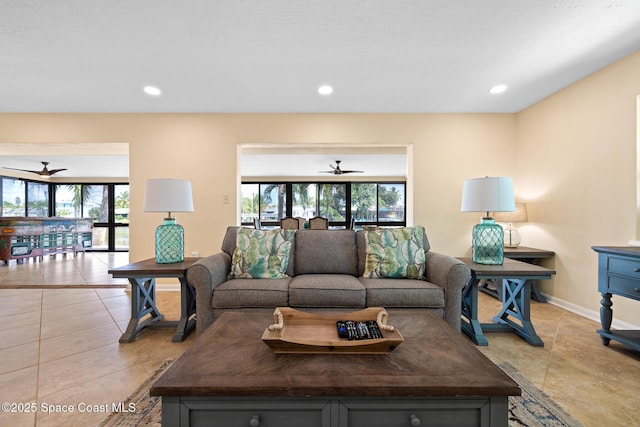 living room featuring light tile patterned floors, a ceiling fan, and recessed lighting
