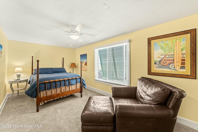 carpeted bedroom with baseboards and ceiling fan