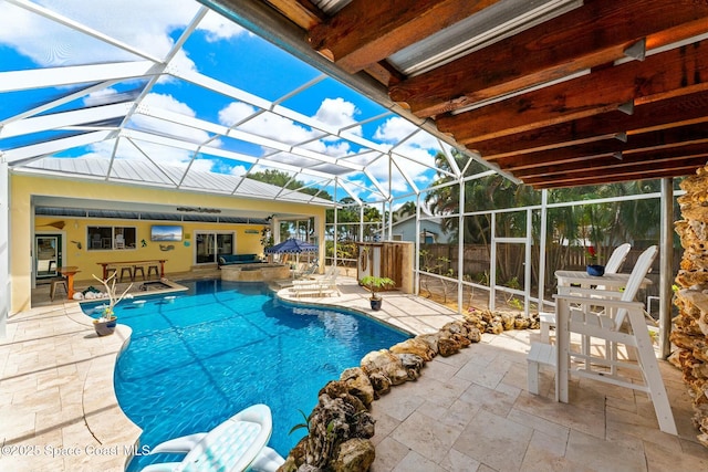 view of swimming pool featuring a patio, a fenced in pool, and a lanai