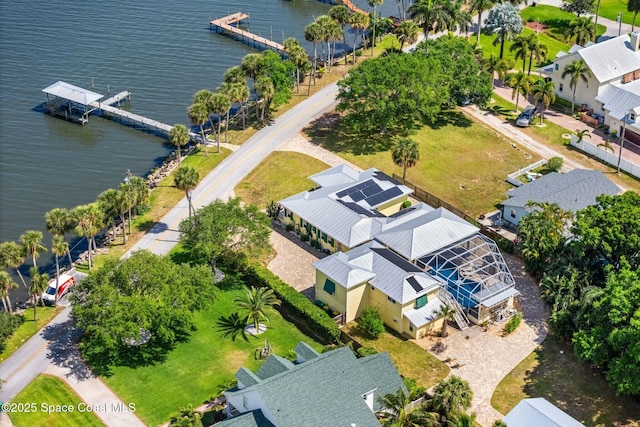 bird's eye view with a residential view and a water view