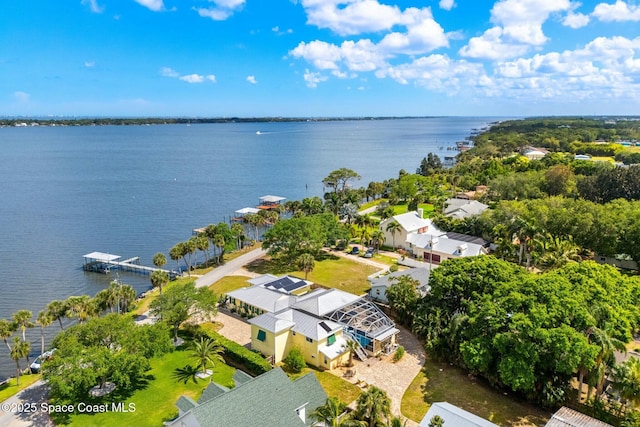 drone / aerial view featuring a water view and a residential view