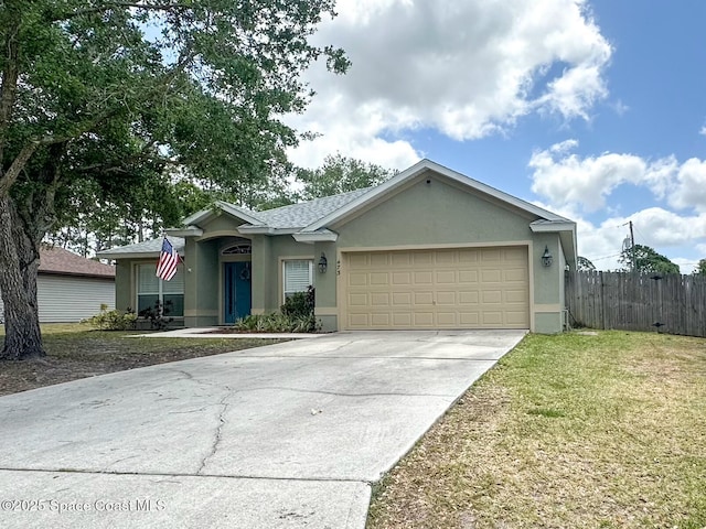 single story home featuring a front yard, stucco siding, concrete driveway, an attached garage, and fence