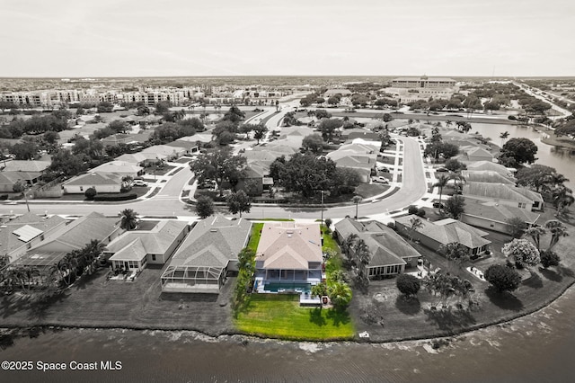 aerial view with a water view and a residential view