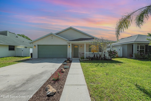 ranch-style house featuring a porch, fence, a front lawn, concrete driveway, and an attached garage