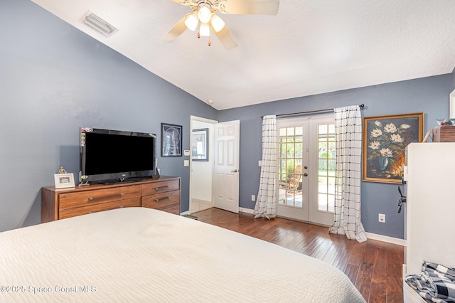 bedroom featuring visible vents, wood finished floors, baseboards, access to outside, and vaulted ceiling