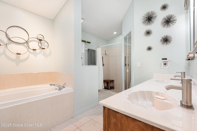 full bathroom featuring a sink, tile patterned floors, a garden tub, and curtained shower