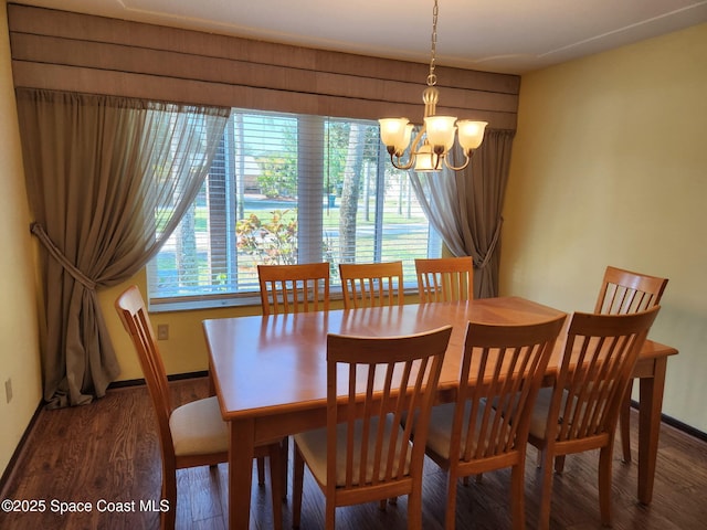 580 Hidden Creek Dr, Merritt Island, FL 32952 - dining room with baseboards, an inviting chandelier, and wood finished floors