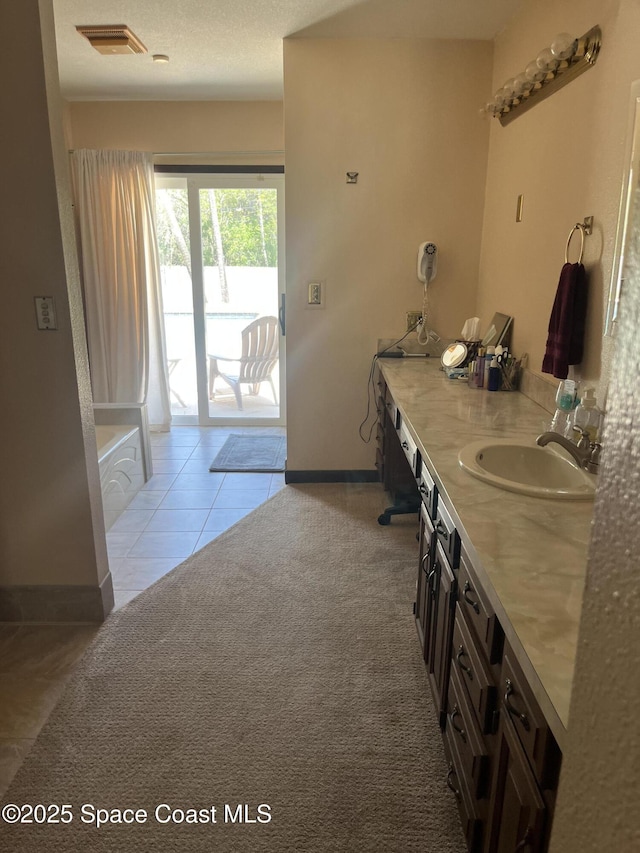 580 Hidden Creek Dr, Merritt Island, FL 32952 - full bathroom featuring visible vents, baseboards, tile patterned floors, and vanity
