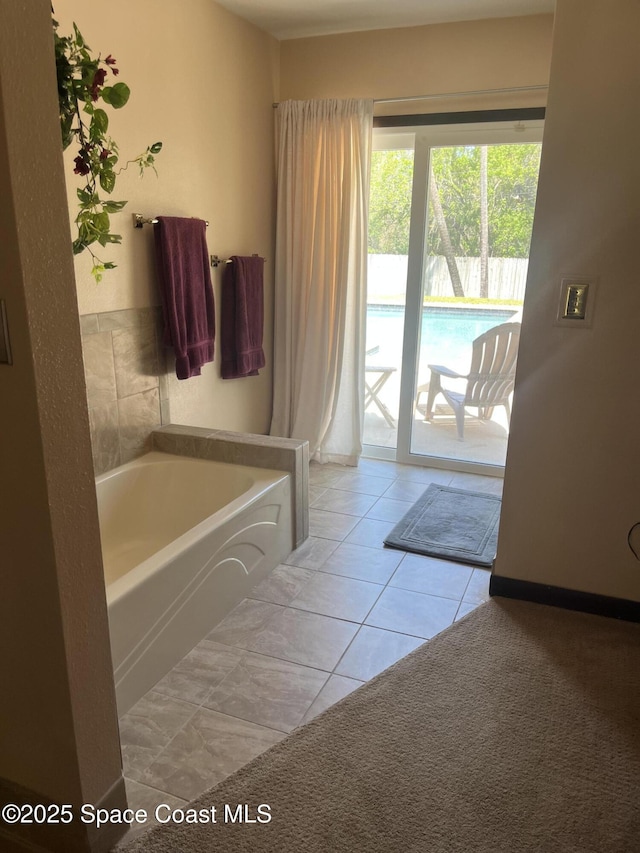 580 Hidden Creek Dr, Merritt Island, FL 32952 - full bath with tile patterned flooring and a bath