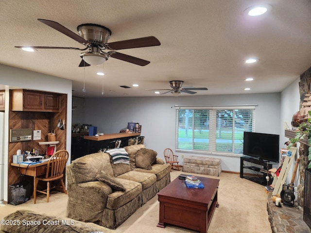 580 Hidden Creek Dr, Merritt Island, FL 32952 - living area featuring recessed lighting, a ceiling fan, a textured ceiling, and light colored carpet