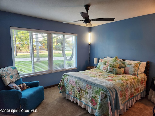 580 Hidden Creek Dr, Merritt Island, FL 32952 - bedroom with baseboards, ceiling fan, and carpet
