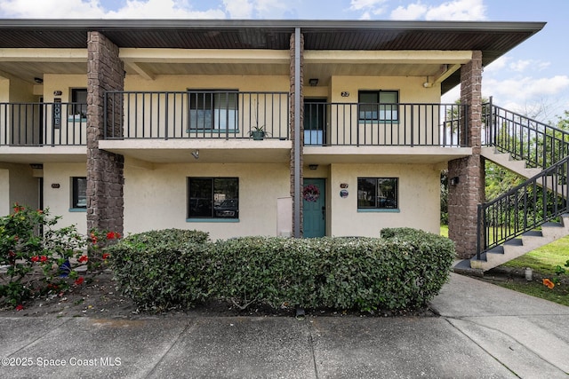 100 Canebreakers Dr Unit 112, Cocoa, FL 32927 - view of front facade with stairs and stucco siding