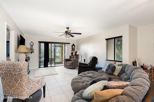 100 Canebreakers Dr Unit 112, Cocoa, FL 32927 - living room featuring baseboards, ceiling fan, and light tile patterned flooring