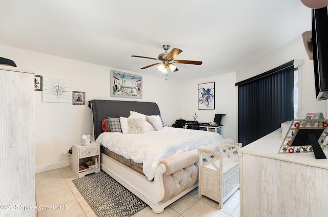 100 Canebreakers Dr Unit 112, Cocoa, FL 32927 - bedroom with light tile patterned floors, baseboards, and a ceiling fan