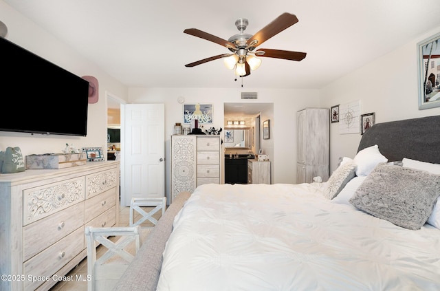 100 Canebreakers Dr Unit 112, Cocoa, FL 32927 - bedroom with a ceiling fan, ensuite bath, and visible vents