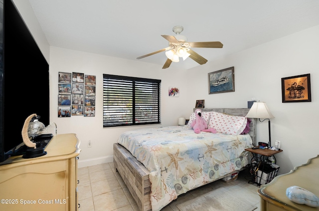 100 Canebreakers Dr Unit 112, Cocoa, FL 32927 - tiled bedroom featuring baseboards and ceiling fan