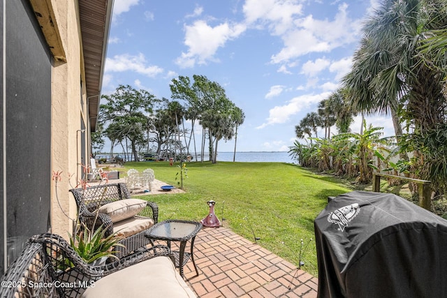 100 Canebreakers Dr Unit 112, Cocoa, FL 32927 - view of yard featuring a water view and a patio area