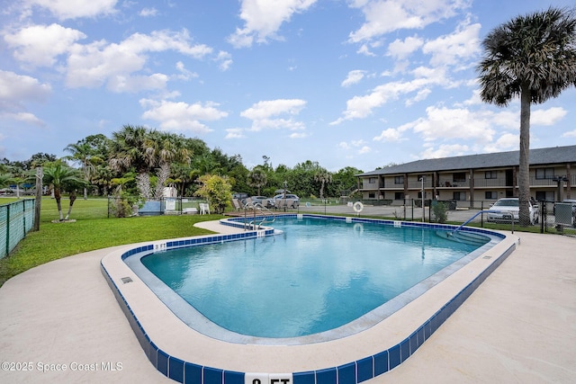 100 Canebreakers Dr Unit 112, Cocoa, FL 32927 - community pool with fence and a yard