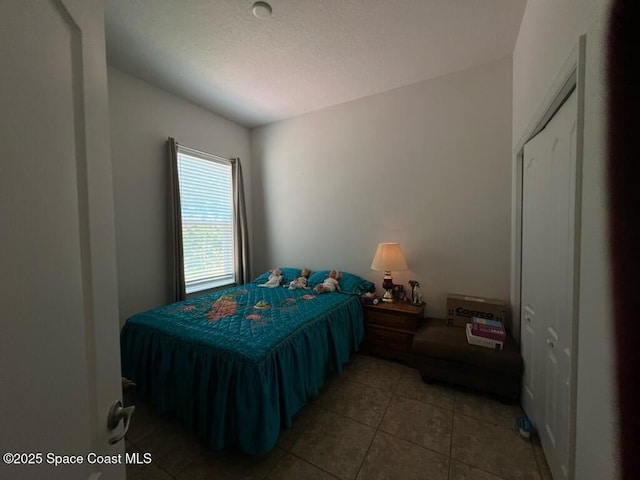 bedroom with light tile patterned flooring