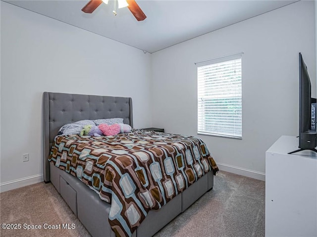 bedroom with carpet floors, baseboards, and a ceiling fan