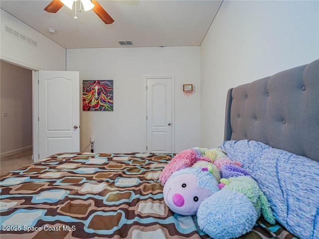 bedroom featuring ceiling fan, visible vents, and baseboards