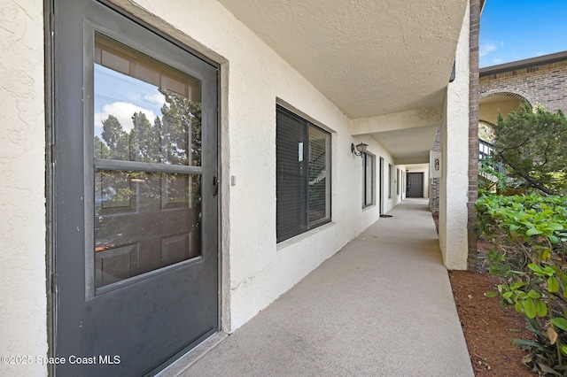 1515 N Huntington Ln Unit 415, Rockledge, FL 32955 - view of exterior entry with stucco siding