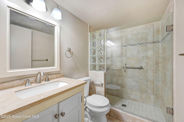 1515 N Huntington Ln Unit 415, Rockledge, FL 32955 - full bathroom with a textured wall, vanity, toilet, a textured ceiling, and a shower stall