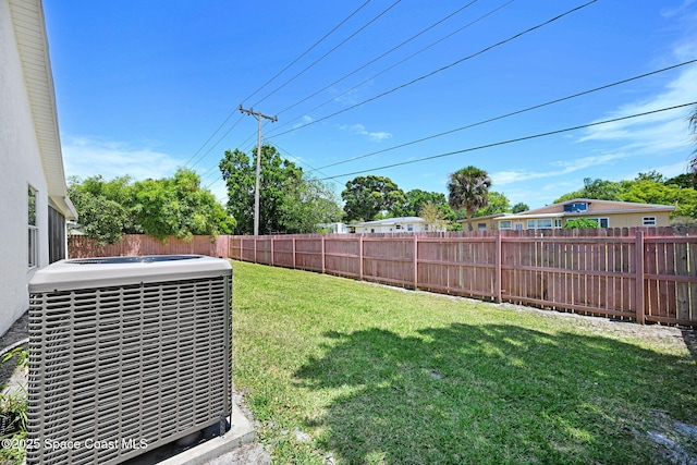 view of yard featuring cooling unit and a fenced backyard