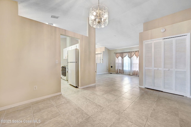 interior space with an inviting chandelier, baseboards, and visible vents