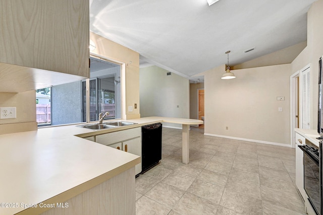 kitchen featuring lofted ceiling, light countertops, a sink, dishwasher, and decorative light fixtures