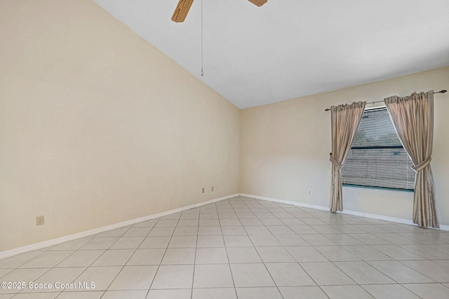 spare room featuring light tile patterned floors, baseboards, and ceiling fan
