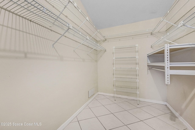 spacious closet with tile patterned flooring