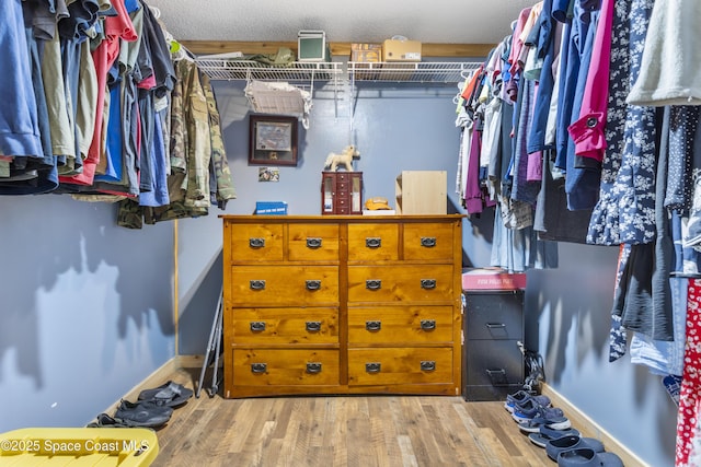 spacious closet featuring wood finished floors