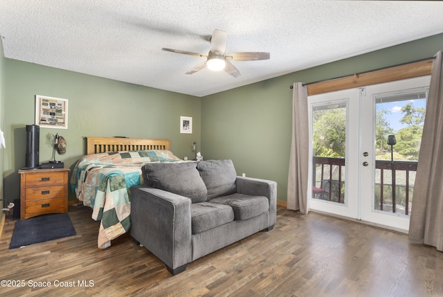 bedroom with wood finished floors, ceiling fan, access to outside, a textured ceiling, and french doors