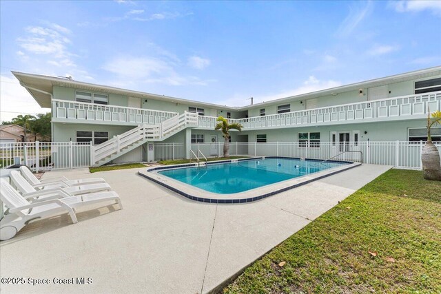 299 E Central Blvd Unit 6, Cape Canaveral, FL 32920 - pool featuring fence, stairs, and a patio area