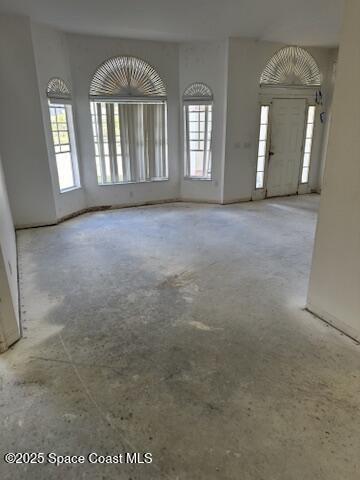 unfurnished living room with a healthy amount of sunlight