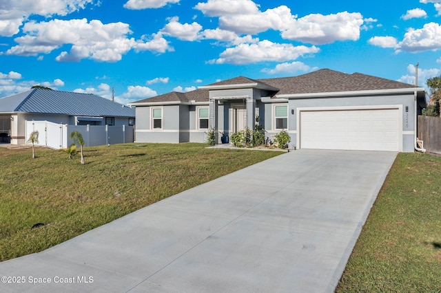 1401 Wyoming Dr SE, Palm Bay, FL 32909 - prairie-style house with driveway, fence, a front lawn, an attached garage, and stucco siding